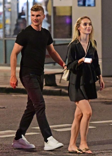 Timo Werner in a black t-shirt caught on a camera with Julia Nagler.